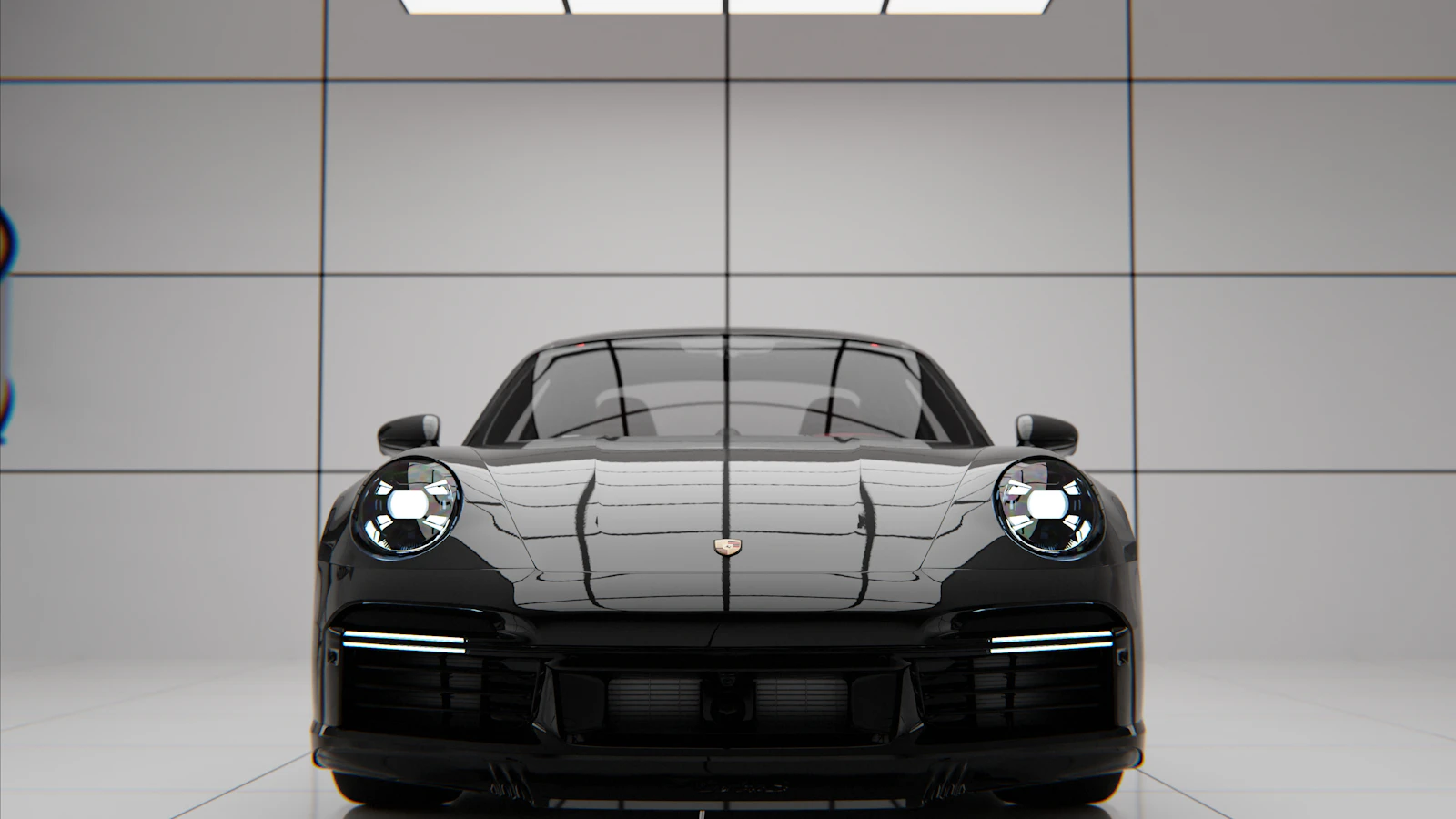 A black luxury sports car parked in a modern, brightly lit showroom